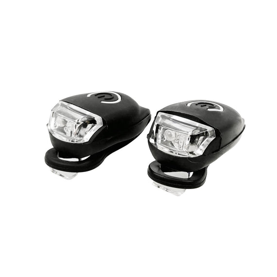 Ett par ljusstarka cykelljus, bak och fram, blinkande och fast ljus